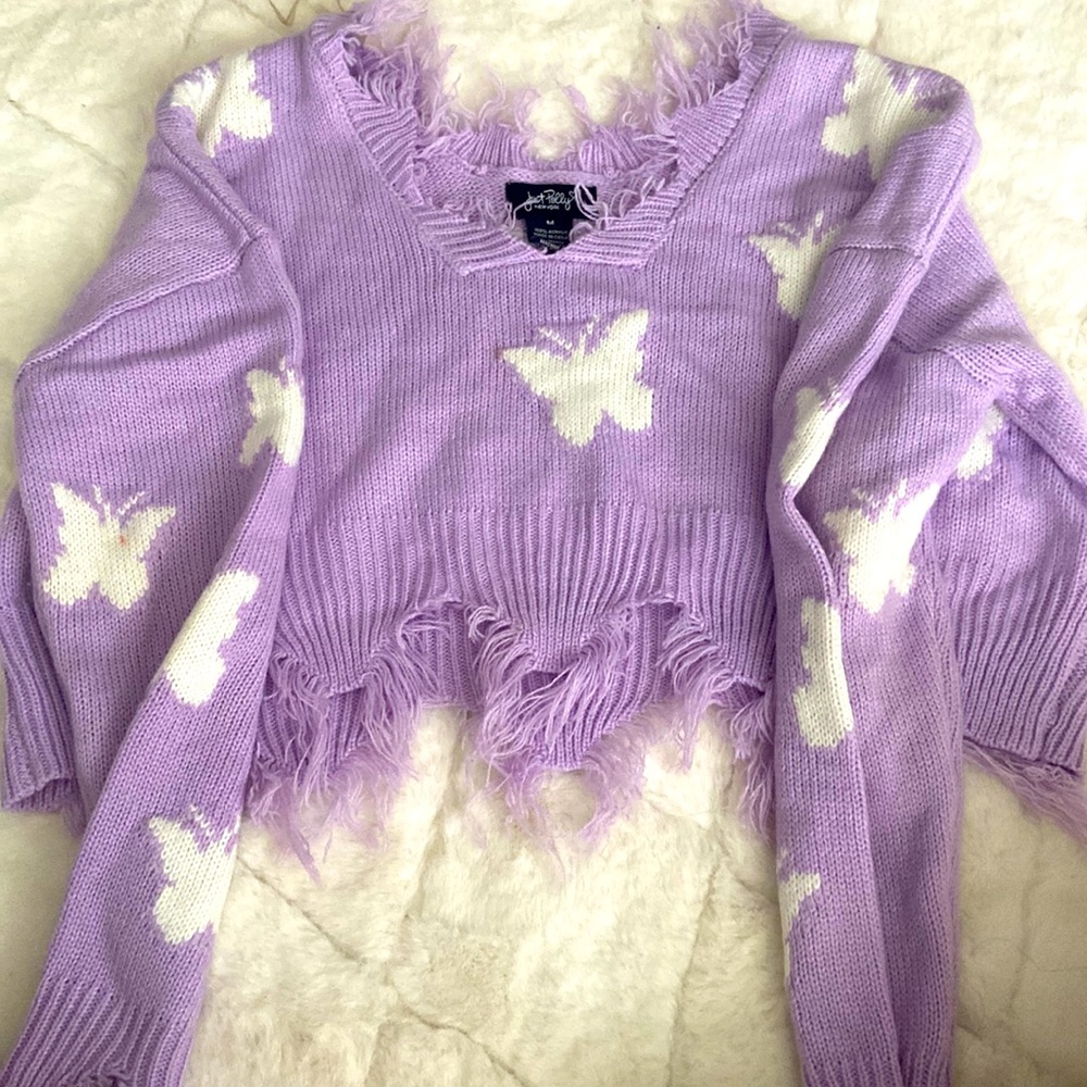 long sleeve top with butterflies.Not long kinda short.